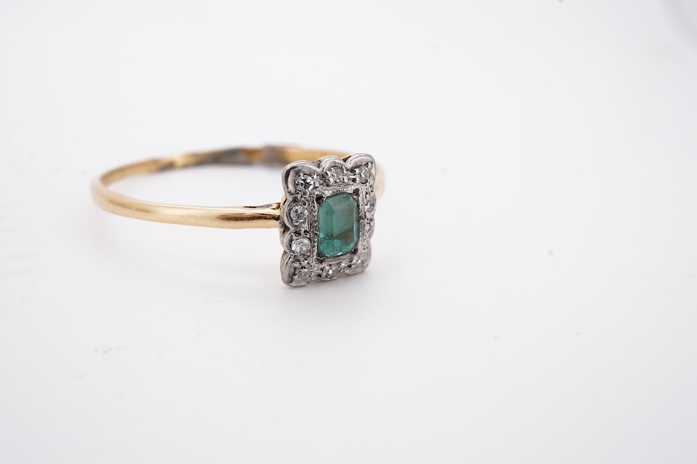 An 18ct and plat. five stone diamond set half hoop ring, size V together with a yellow metal emerald and diamond set tablet ring, size Z+++, gross weight 4.5 grams. Condition - fair